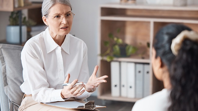 psychologist talking to patient